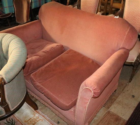 Pink settee, on claw and ball feet, with cushions